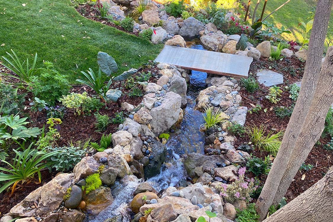 DREAMSCAPES WATER FEATURES AND LANDSCAPING LLC logo